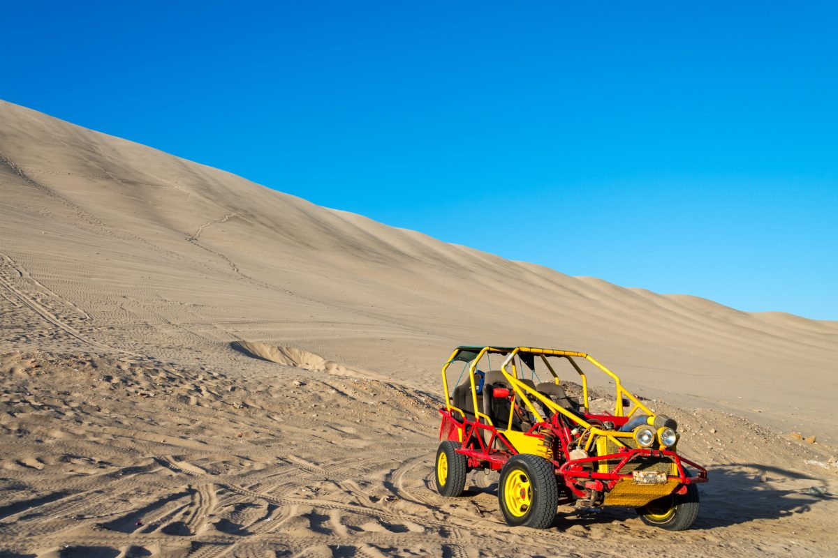 Dune,Buggy,At,The,Foot,Of,A,Large,Sand,Dune Dune,Buggy,At,The,Foot,Of,A,Large,Sand,Dune